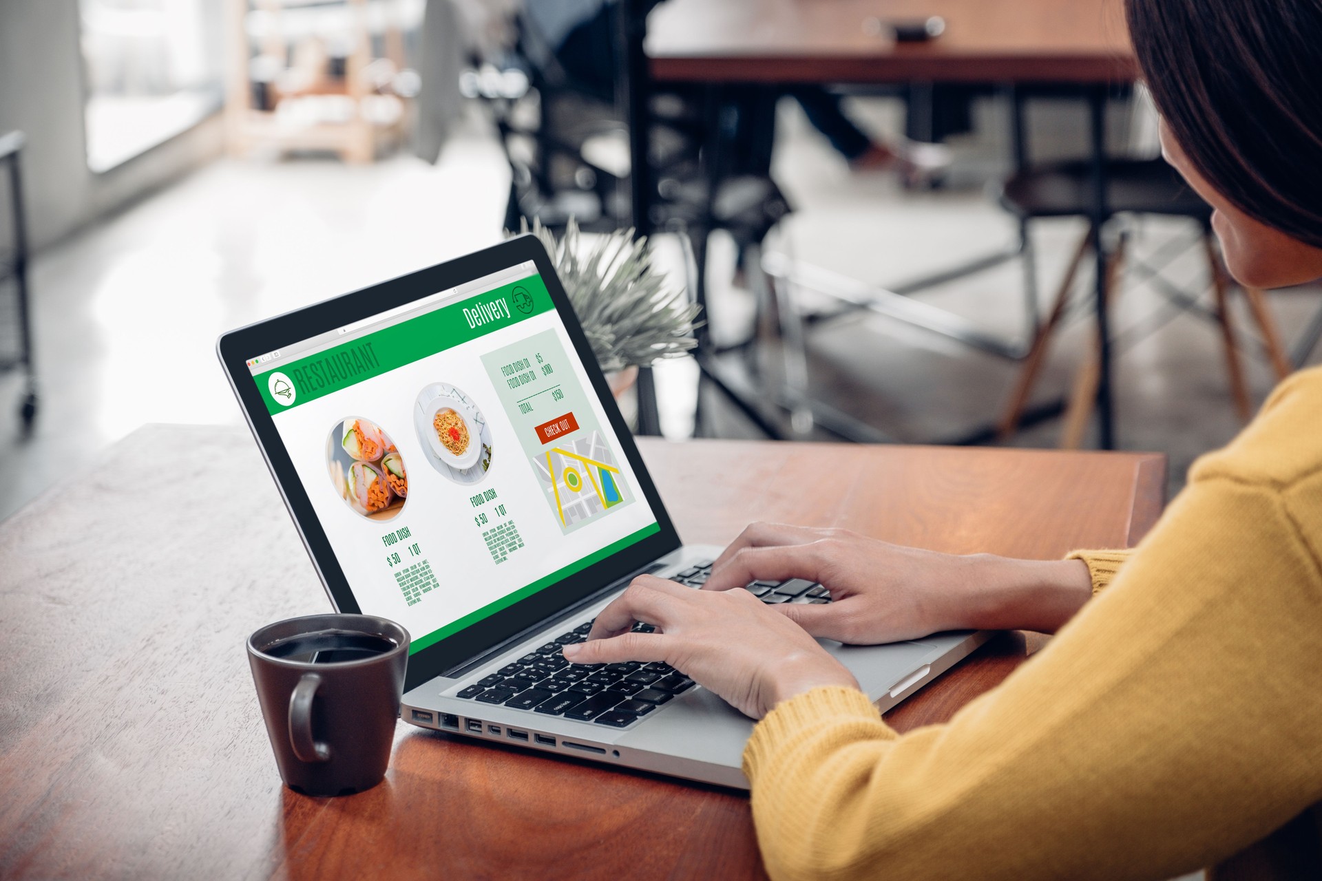Close up woman sitting and orde food online on laptop computer in add to cart function webpage at coffee shop,Digital marketing concept.digital lifestyle living